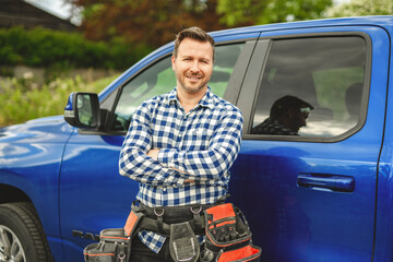 Man engineer builder in front of his pickup