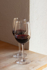 Vertical View of Two Red Wine Glasses on Wood