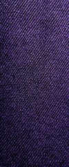 A textured fabric with a deep, dark hue, showcasing intricate patterns that create a visually appealing surface.