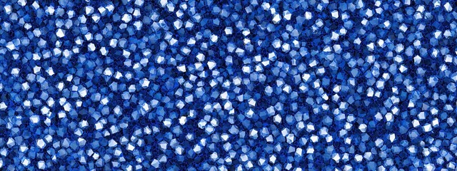 A vibrant array of blue sequins glistening, showcasing various shades and textures, perfect for creative projects or fashion embellishments.