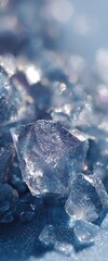 A close-up image of shimmering ice crystals reflecting light, creating a sparkling blue and silver effect.