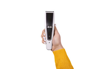 Female hand holding a modern electric hair trimmer isolated, showcasing grooming tool in vertical position.