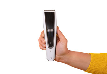 Close-up of a hand in yellow sleeve holding a modern electric beard trimmer isolate.