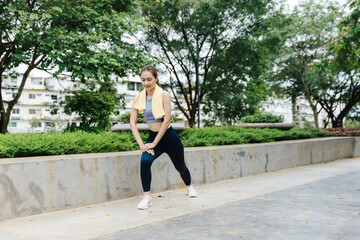Yoga practice in urban park woman stretching outdoor fitness environment serene viewpoint