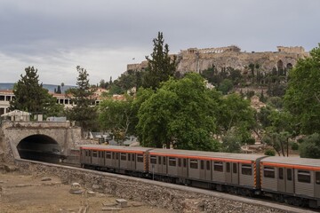 Subway Train Passing by the Ancient Acropolis in Athens, Greece