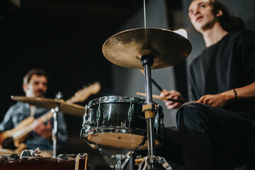 Focused musicians practicing their instruments in a band rehearsal, creating a vibrant musical ambiance that captures the essence of live performance in a practice session.