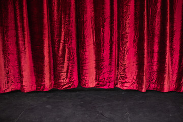 Stage with red curtains background. Closed theatre curtain before entertainment presentation