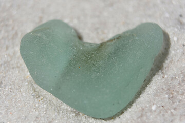 Heart Shaped Sea Foam Sea Glass on White Sand