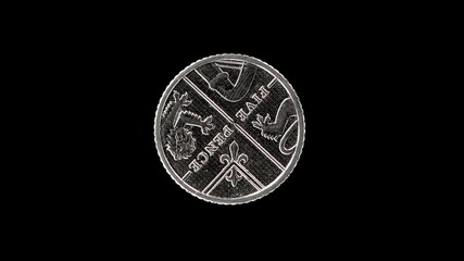 United Kingdom 5 pence 2012 reverse showing Royal Shield segment, macro loop on black background