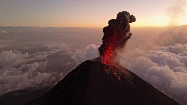 Guatemala active volcano eruption and spitting lava, aerial view