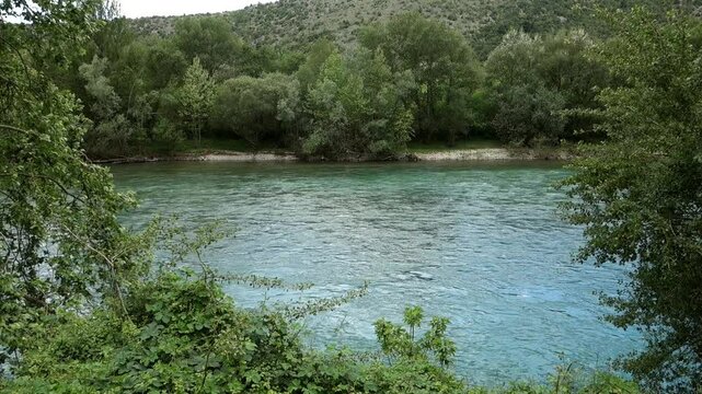 Neretva river flowing down through the landscape in Bosnia Herzegovina, balcan peninsula, Europe