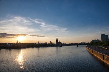 Fototapeta premium Cologne Skyline and Rhine River at Sunset with Cologne Cathedral Silhouette