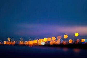 Blurred city lights at twilight over water
