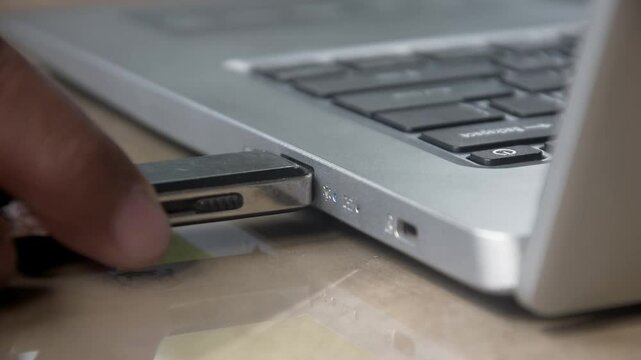 Flash drive is connected to the laptop via the USB port