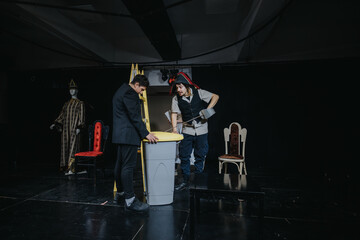 Two young actors performing a play on a stage with props in a theater setting, showcasing an...