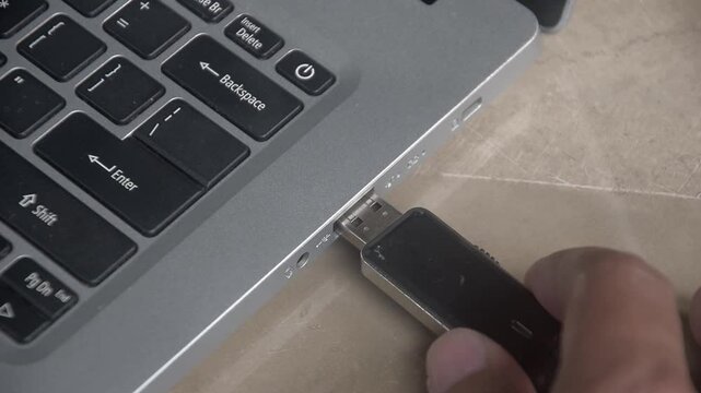 Flash drive is connected to the laptop via the USB port