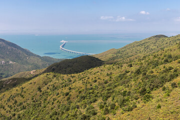 Lantau Island, Hong Kong, 10-20-2024 Views over Lantau Island seen from the cable car which connects downtown Tung Chung and Ngong Ping with the statue of the biggest buddha and the Po Lin Monastery