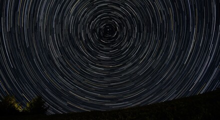 Long exposure star trails forming a perfect circular pattern in the night sky, symbolizing cosmic order and infinity, close-up
