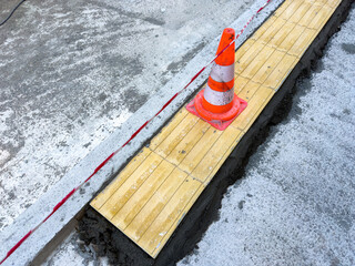 Road construction site with pylons in the center of the old town