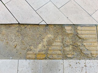 Footprint on the sidewalk in the city, closeup of photo