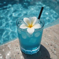 Refreshing blue tropical drink with flower garnish beside shimmering pool on a sunny day