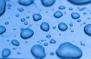 A blue background with many small blue droplets