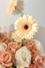 Soft floral composition with white and peach flowers