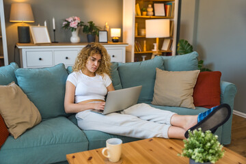 Young university student working side hustle to pay rent and costs of living as translator. Woman...