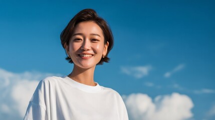 Cheerful Japanese woman smiling, bright blue sky highlighting fluffy white clouds surrounding her