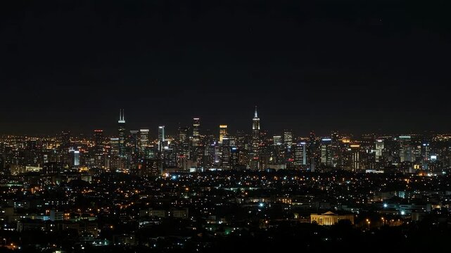 Night city skyline with illuminated buildings and lights  