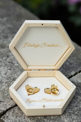 Large wooden box with gold inscriptions of the names Alexander and Irina, two mirrored ring holders...