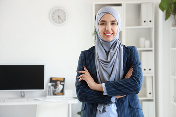 Portrait of beautiful Muslim businesswoman in office