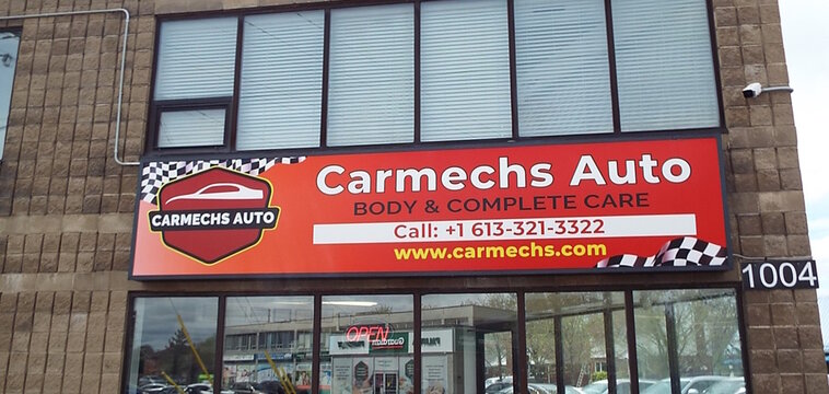 Ottawa, ON, Canada-June 08,2025:The storefront of "Carmechs Auto" which offers "BODY and COMPLETE CARE" at 1004 Merivale Road.

