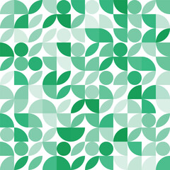 A repeating geometric pattern featuring various shapes, including circles, leaves, and semi-circles, in shades of green on a white background.