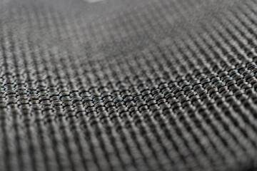 A close-up, high-quality image of a luxurious, sturdy mesh fabric with an intricate, uniform weave...
