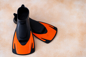 Pair of orange fins for swimming. Sports water equipment for the pool. Scuba flippers © Real_life