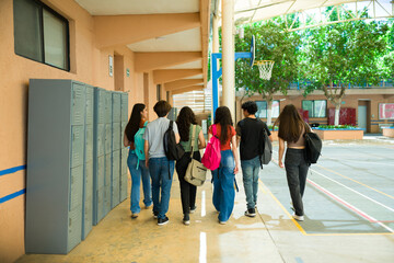 High school students walking in school hallway after class © AntonioDiaz