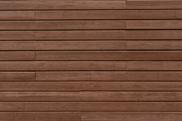 Dark brown aged wooden planks with a rich. Their vintage surface carries the marks of years, adding...