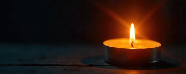 Close-up of a flickering candle flame, casting a warm, inviting glow on a dark background Perfect for concepts of romance, warmth, memory, and tranquility , home, dark