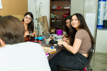 Group of high school students working on electronics project