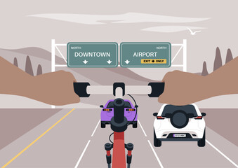 Two hands gripping a bike's handlebars head north on the highway, Cars occupy the lanes in front of the cyclist, with signs indicating directions to Downtown and the Airport