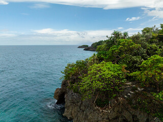 Tropical Island with rocky coastline. Carabao Island. Romblon, Philippines.