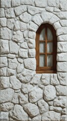 a white stone wall with an arched wooden window