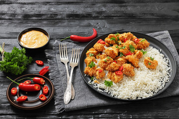 panko-breaded chicken bites with rice and sauce