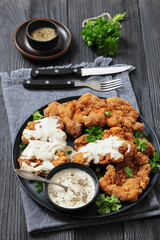 Deep fried Southern chicken thighs with milk gravy