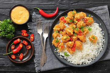 panko-breaded chicken bites with rice and sauce