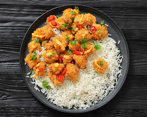 panko-breaded chicken bites with rice and sauce