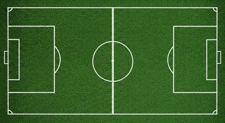 Naklejka premium Aerial shot of a soccer field with green grass and white line markings. The image is symmetrical.