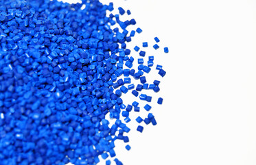 Blue plastic granules on white background
