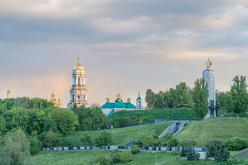 Aerial view of two churches in a rural, lush green landscape during early spring or summer The...